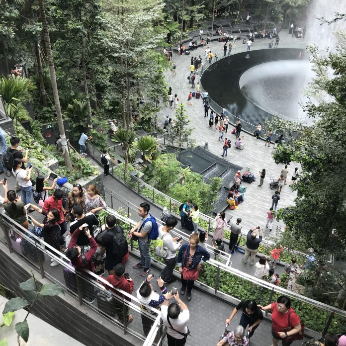 people gathering in Singapore airport